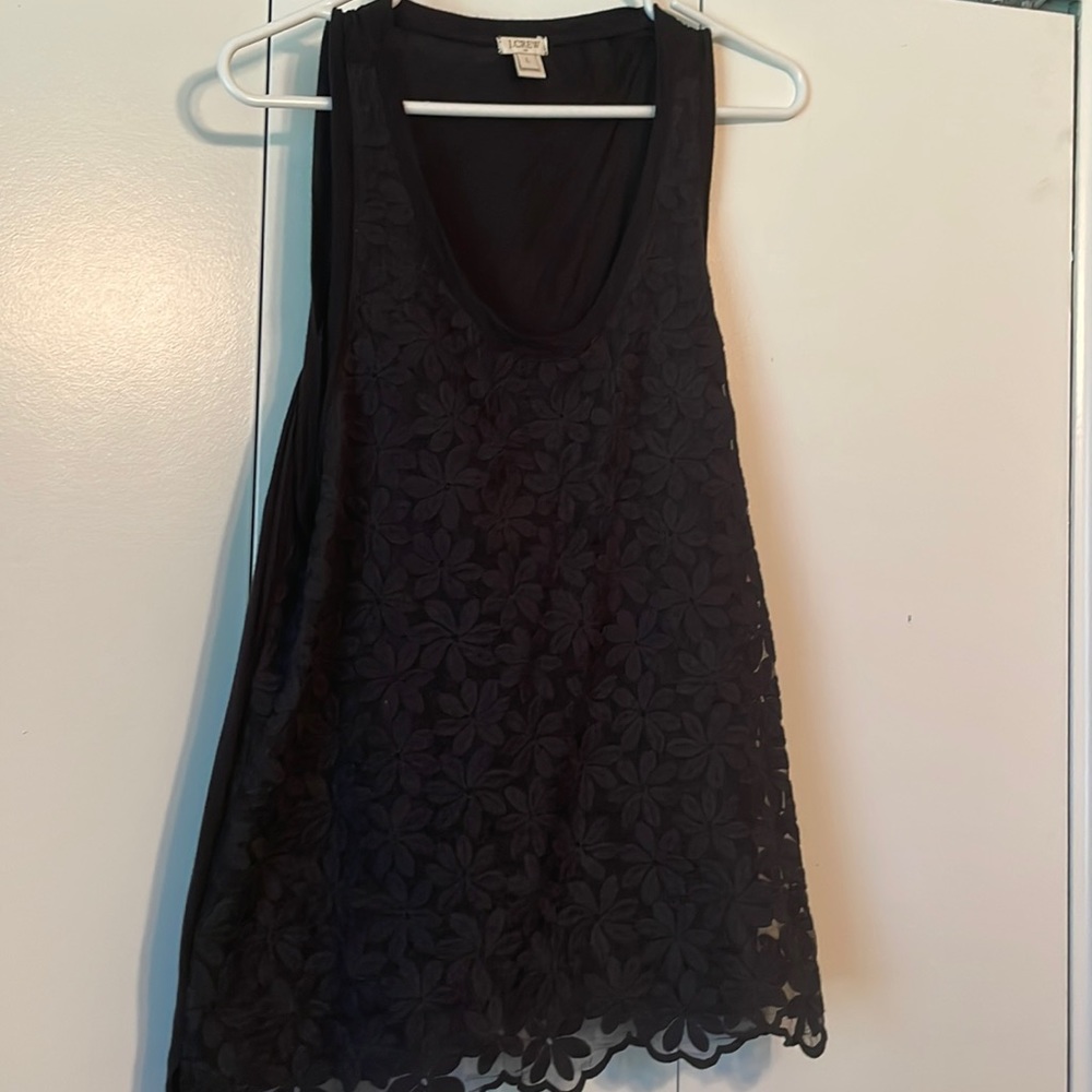 Sleeveless Black tank top with overlay.